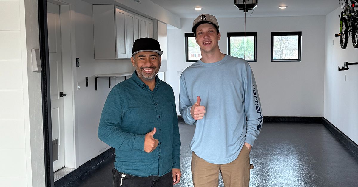 Owner with happy client in finished garage