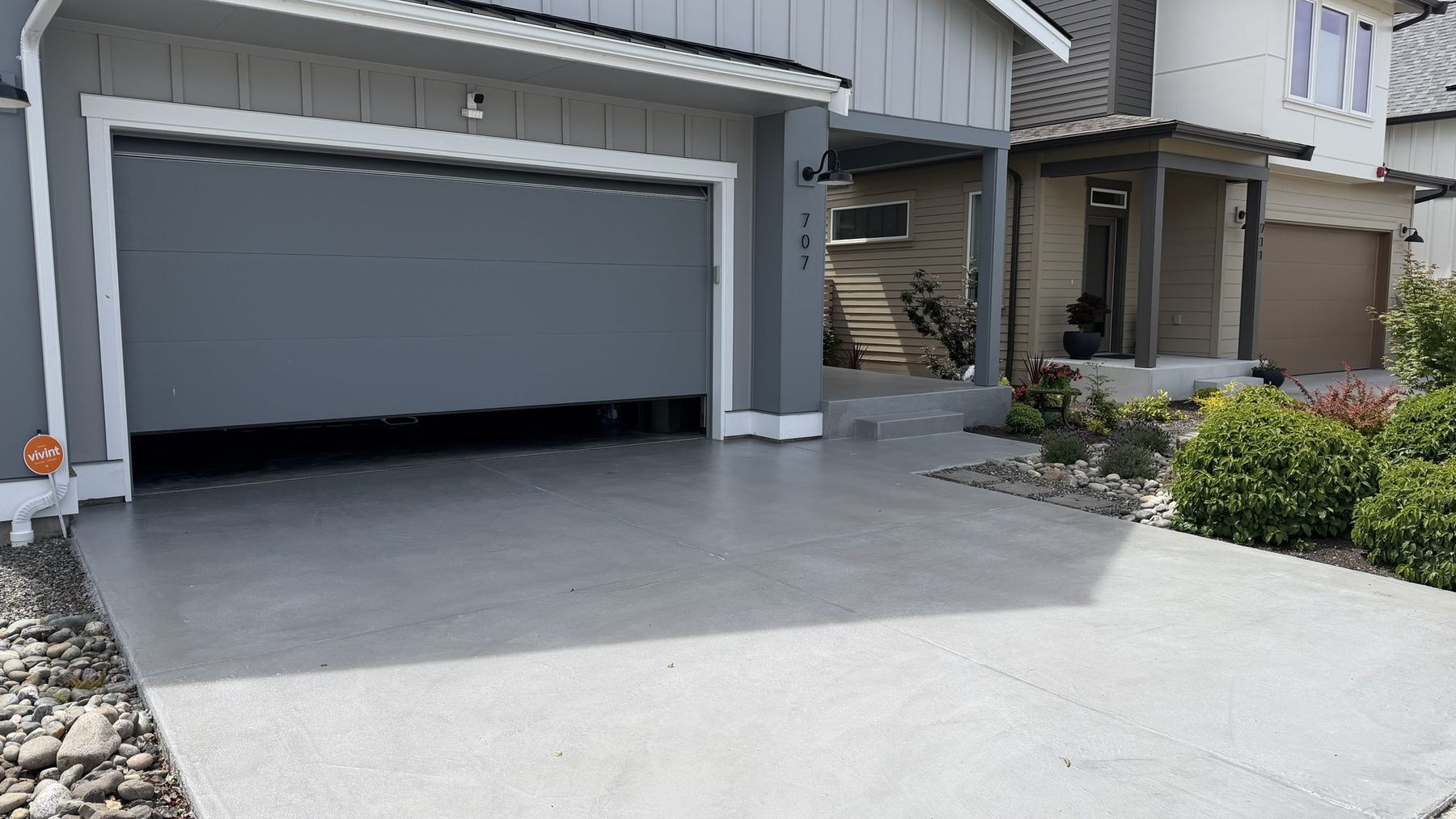 Dark gray concrete overlay driveway