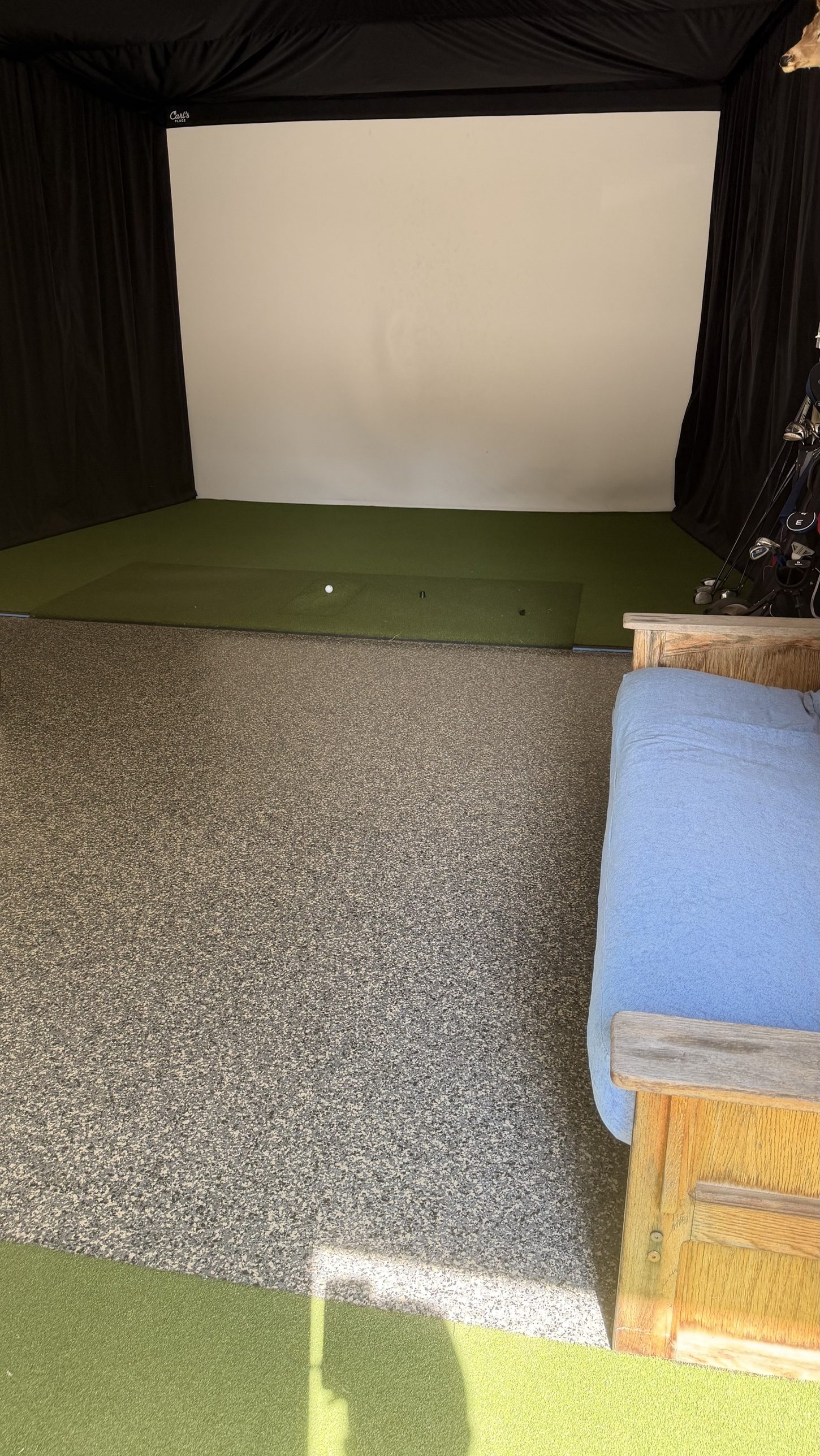Golf simulator room on flake - turf meets coating