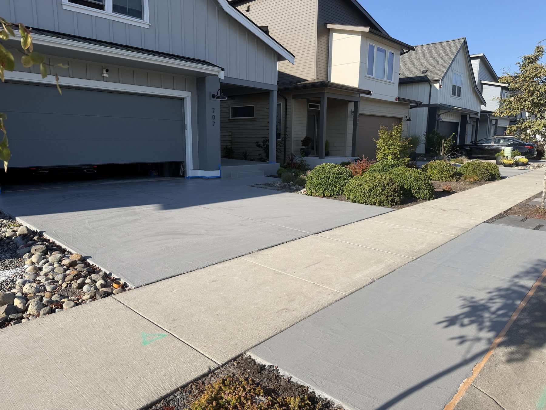 Driveway, walkway and porch resurfaced in solid gray