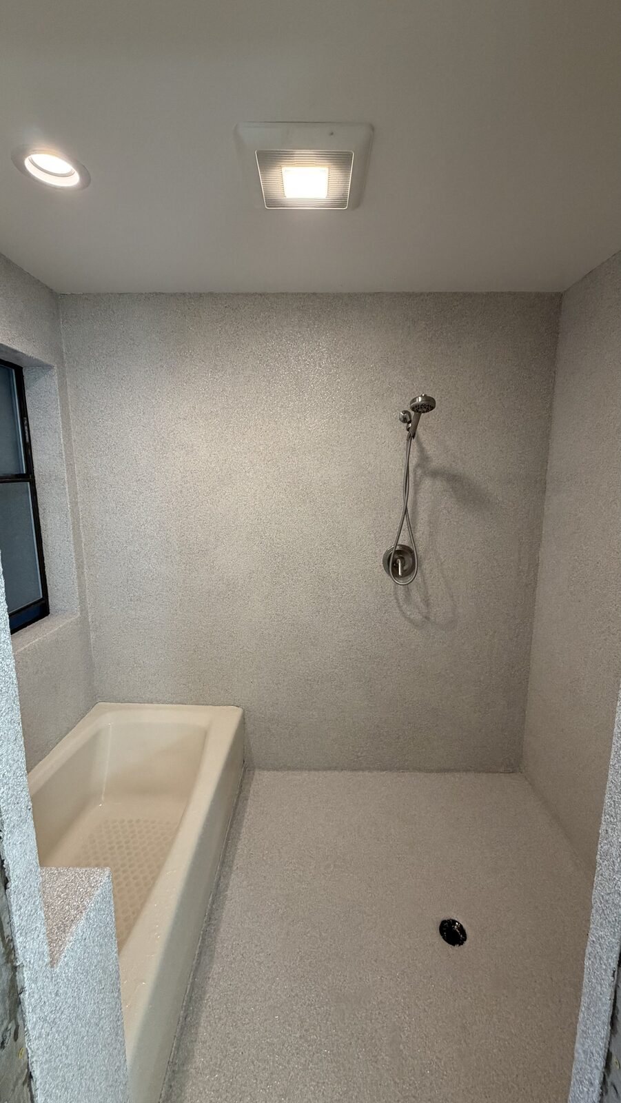 Our install - walk-in shower pan, one seamless surface to the drain
