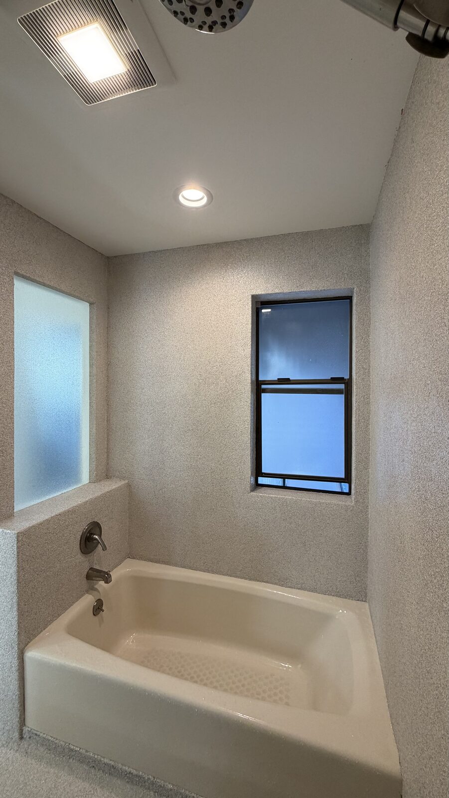 Our install - flake walls wrap tub, window and ledge, no grout anywhere